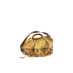 Fossil satchel or hobo-style bag with wooden handles